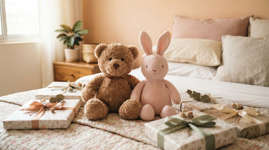 A soft teddy bear and bunny plush toy on a bed in Dhaka, Bangladesh